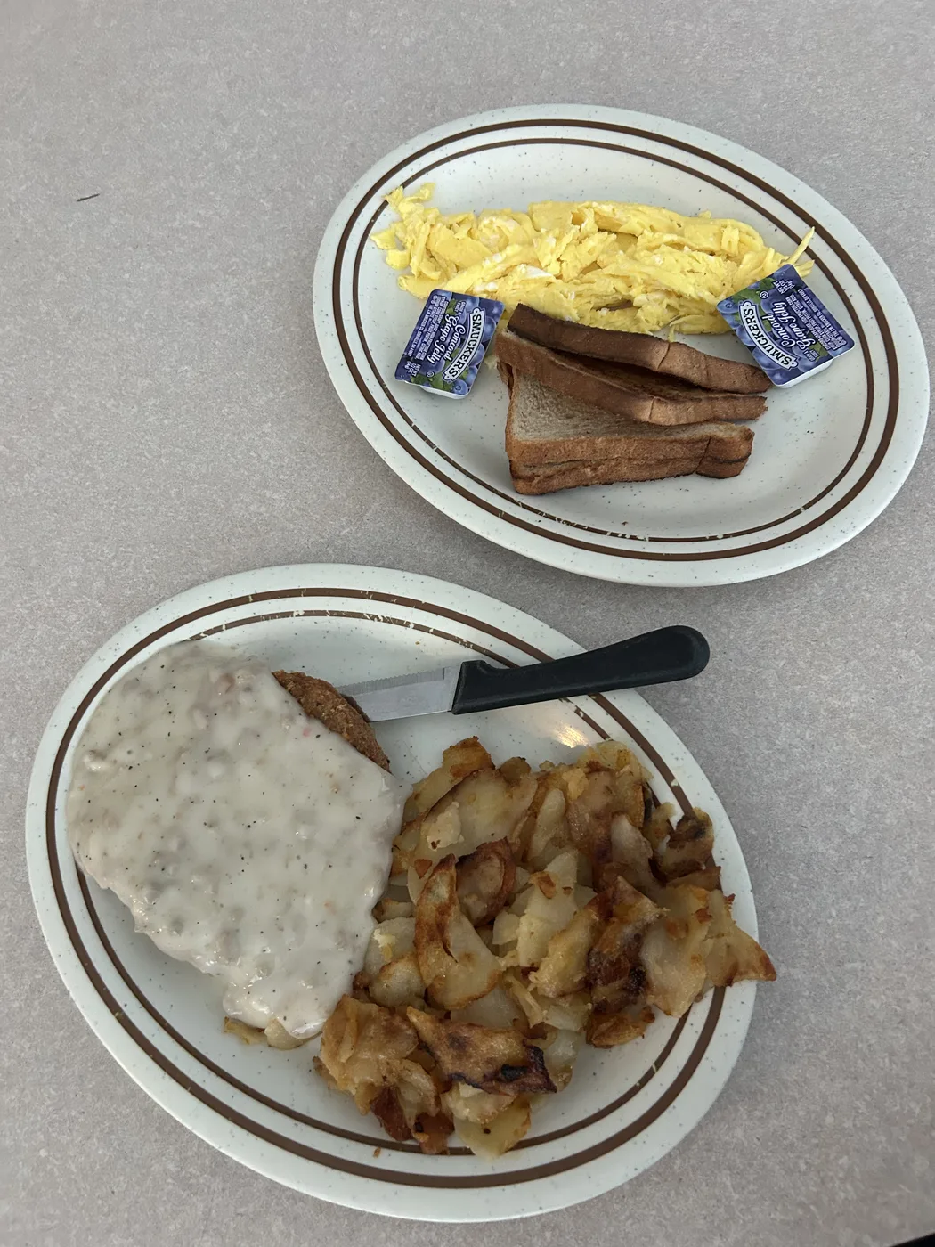 Country fried steak with sausage gravy, two eggs and home fries at Studebaker's Country Restaurant